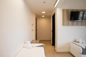 Postel nebo postele na pokoji v ubytování Dafni Plus Hotel