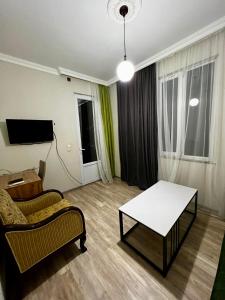 TV a/nebo společenská místnost v ubytování Guest House Leon