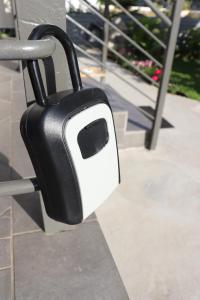 a black and white toaster hanging on a rail at Lia's studio in Skotina