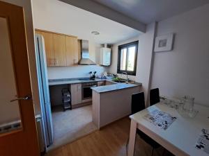 a kitchen with a sink and a counter top at La Pobla estació in La Pobla de Segur