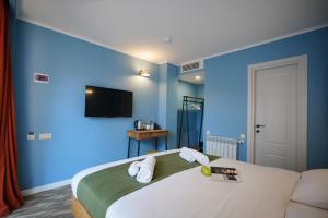 Postel nebo postele na pokoji v ubytování Station 22 Hotel