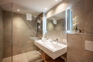 חדר רחצה ב-Hotel Pension Alpengruß