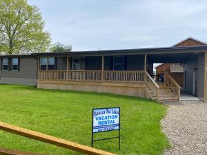 a house with a sign in front of it at Weller Island Retreat in Hammondsport