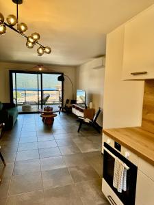 Kuchyň nebo kuchyňský kout v ubytování Appartement confort vue mer