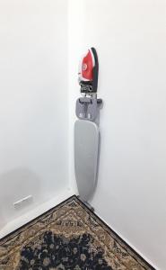 a door with a red lock on a white wall at Alya Homestay 295 Sik in Sik