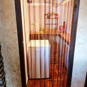 a bird cage with a toilet in a room at Casa Vaélico in Arenas de San Pedro