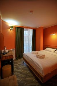 Postel nebo postele na pokoji v ubytování Station 22 Hotel
