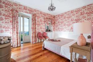 Giường trong phòng chung tại La Capinera