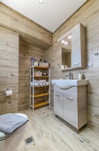 a bathroom with a sink and a toilet at AGALI HOUSE in Limenaria +67 photos