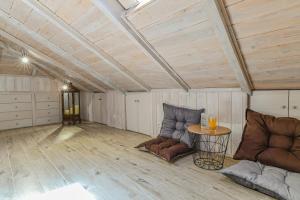 a living room with a couch and a table at AGALI HOUSE in Limenaria