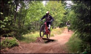 a person riding a bike on a dirt trail at Sur la rive du Lac in Orbey