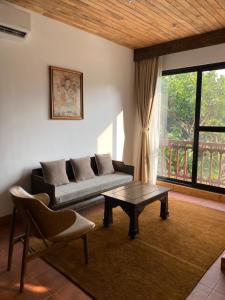 Ein Sitzbereich in der Unterkunft Uma Residence and Suites
