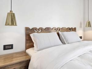 Ein Bett oder Betten in einem Zimmer der Unterkunft Uma Residence and Suites