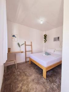 Postel nebo postele na pokoji v ubytování Camotes Hostel Resort