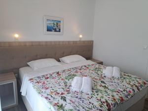 Postel nebo postele na pokoji v ubytování Rooms & Apartment Mama Mia