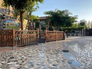 a park with a wooden fence and a playground at Exclusivo Loft en Zaragoza-4 in Zaragoza