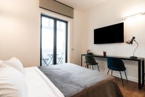 Postel nebo postele na pokoji v ubytování Panoramic Flat-Les Suites
