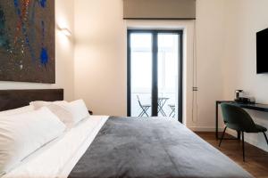 Postel nebo postele na pokoji v ubytování Panoramic Flat-Les Suites