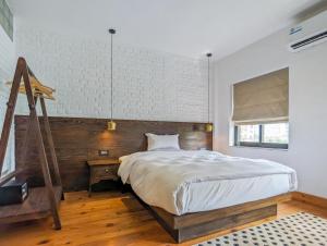 Ein Bett oder Betten in einem Zimmer der Unterkunft Uma Residence and Suites