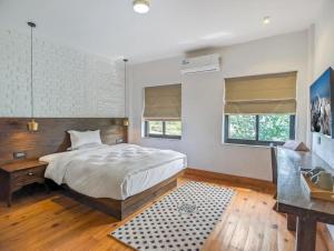 Ein Bett oder Betten in einem Zimmer der Unterkunft Uma Residence and Suites