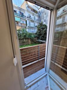 a window with a view of a building at Vt Homes in Corfu