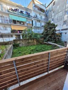a wooden fence in front of a building at Vt Homes in Corfu
