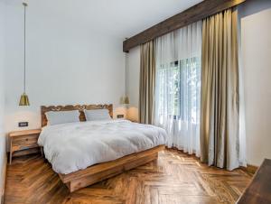Ein Bett oder Betten in einem Zimmer der Unterkunft Uma Residence and Suites