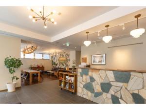 a lobby with a counter and a dining room at Hotel Emit Shibuya - Vacation STAY 40894v in Tokyo