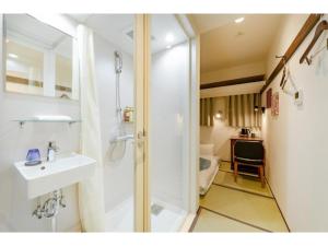 a bathroom with a sink and a shower and a toilet at Hotel Emit Shibuya - Vacation STAY 40886v in Tokyo +23 photos