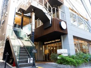 a building with a staircase in front of it at Hotel Emit Shibuya - Vacation STAY 40886v in Tokyo