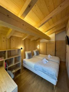 Postel nebo postele na pokoji v ubytování Chalet Clos du Nant Megève