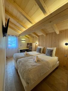 Postel nebo postele na pokoji v ubytování Chalet Clos du Nant Megève