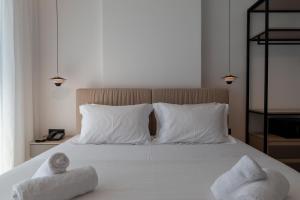 Uma cama ou camas num quarto em Litan Hotel