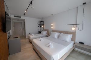 Uma cama ou camas num quarto em Litan Hotel