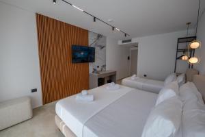 Uma cama ou camas num quarto em Litan Hotel