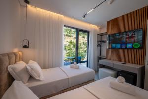 Uma cama ou camas num quarto em Litan Hotel