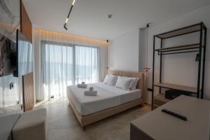 Uma cama ou camas num quarto em Litan Hotel