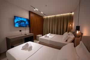 Uma cama ou camas num quarto em Litan Hotel