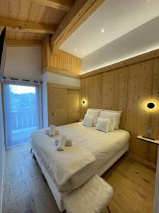 Postel nebo postele na pokoji v ubytování Chalet Clos du Nant Megève