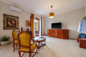 TV o dispositivi per l'intrattenimento presso Gargiulo Suites