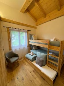 Postel nebo postele na pokoji v ubytování Chalet Clos du Nant Megève