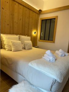Postel nebo postele na pokoji v ubytování Chalet Clos du Nant Megève