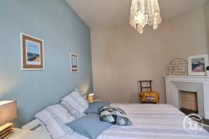 Postel nebo postele na pokoji v ubytování Le petit cottage