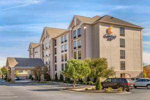 a rendering of a hotel with cars parked in a parking lot at Comfort Inn Greensboro - Kernersville in Greensboro