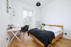 Posteľ alebo postele v izbe v ubytovaní Kraków Apartament Blisko Centrum Kongresowego i Wawelu by Noclegi Renters