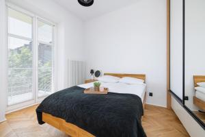 Posteľ alebo postele v izbe v ubytovaní Kraków Apartament Blisko Centrum Kongresowego i Wawelu by Noclegi Renters