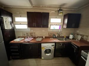 A kitchen or kitchenette at El Rehab city Cozy apartment 3 bedrooms