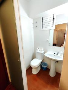 a bathroom with a toilet and a sink at Hostal La Torre in Benicàssim
