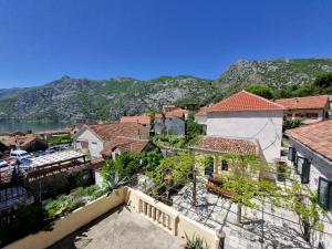 a view of a town with mountains in the background at Villa Nicole in Risan