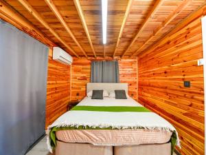 a bedroom with a bed in a wooden cabin at TÜRKMEN VİLLAS in Demre +15 photos